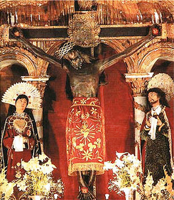 ...has its unique Earthquake Lord Black Christ, made of wood which has collected centuries of candle soot and grime, flanked by Mary and Joseph...