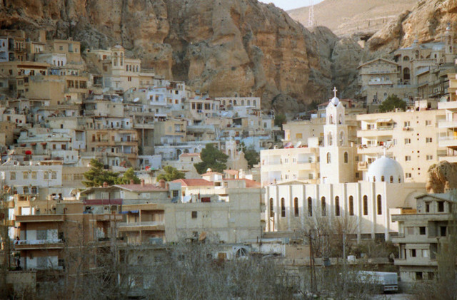 The hillside village of Maalula, where Aramaic, the language of Jesus, is still spoken. Both Christian and Muslim pilgrims pray together at Ma'lula's two monasteries.
